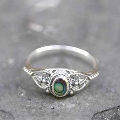 Anello con design in filigrana con conchiglia arcobaleno